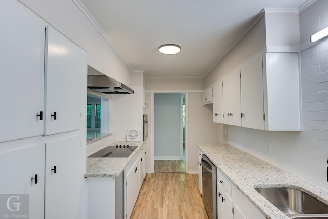 kitchen featuring black electric cooktop, sink, light stone counters, and white cabinets