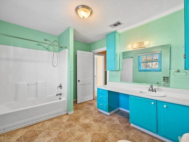 bathroom with vanity and bathing tub / shower combination