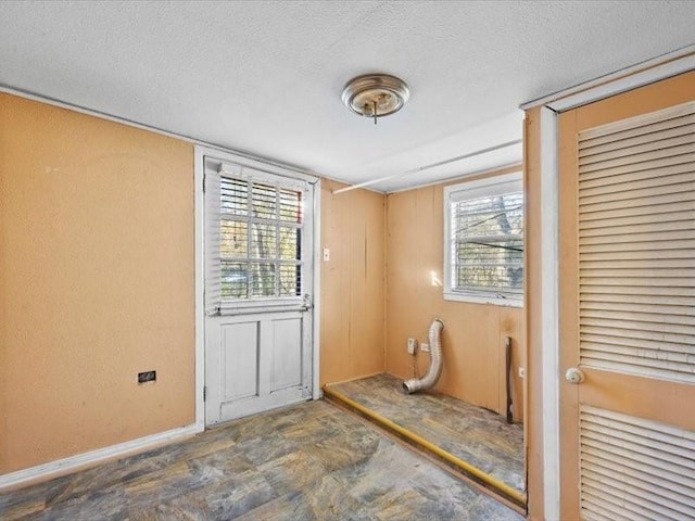 spare room featuring a textured ceiling