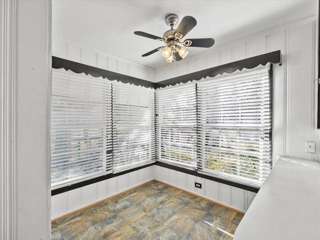 interior space featuring ceiling fan