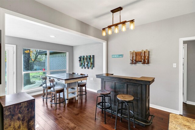 kitchen featuring white appliances, sink, tasteful backsplash, cream cabinetry, and dark hardwood / wood-style flooring