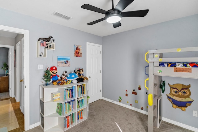 carpeted bedroom with ceiling fan