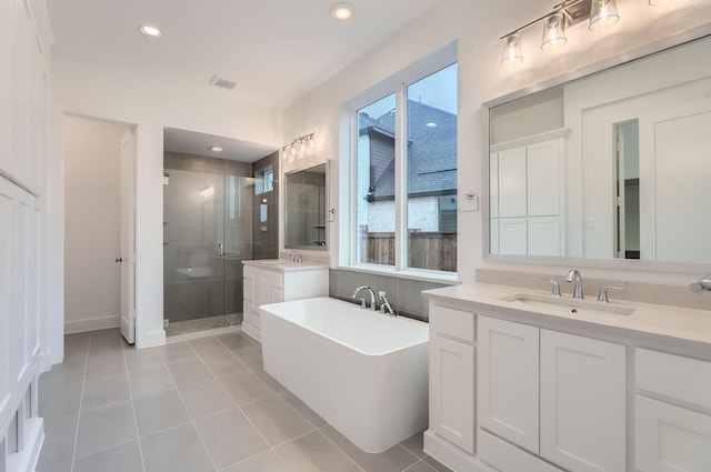 bathroom with vanity, separate shower and tub, and tile patterned floors