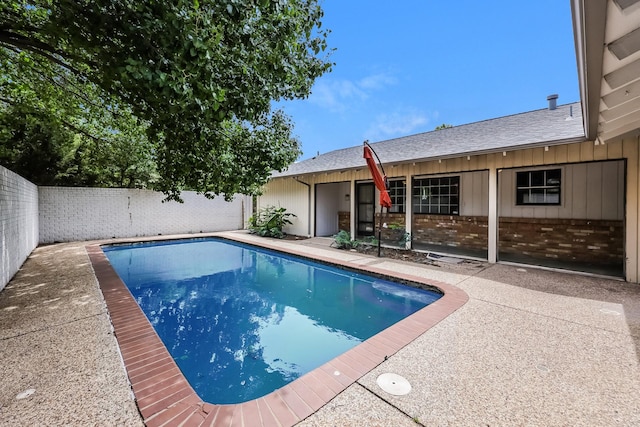 view of swimming pool with a patio area