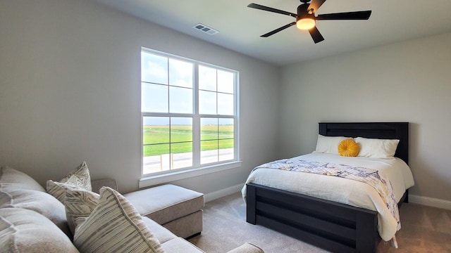 carpeted bedroom with ceiling fan