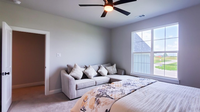 bedroom featuring light colored carpet and ceiling fan