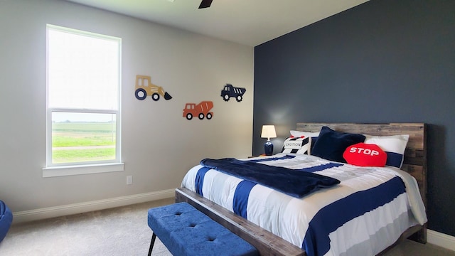 carpeted bedroom featuring ceiling fan