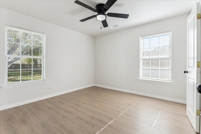 spare room featuring ceiling fan and light hardwood / wood-style flooring