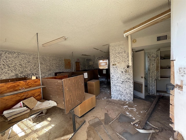 miscellaneous room featuring a textured ceiling