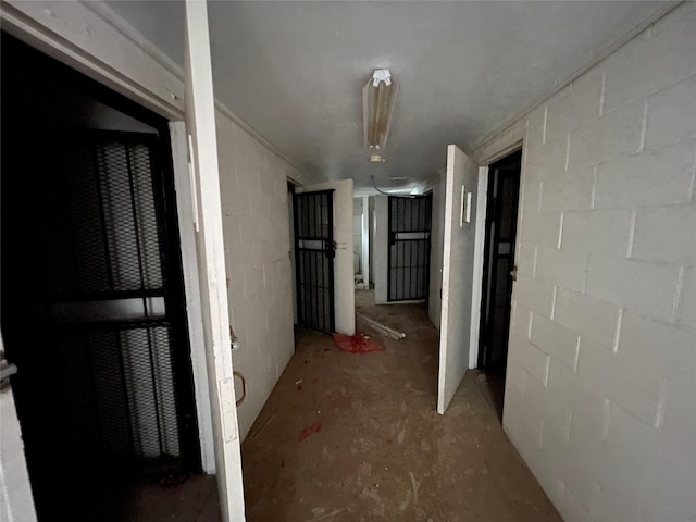 hallway with concrete flooring