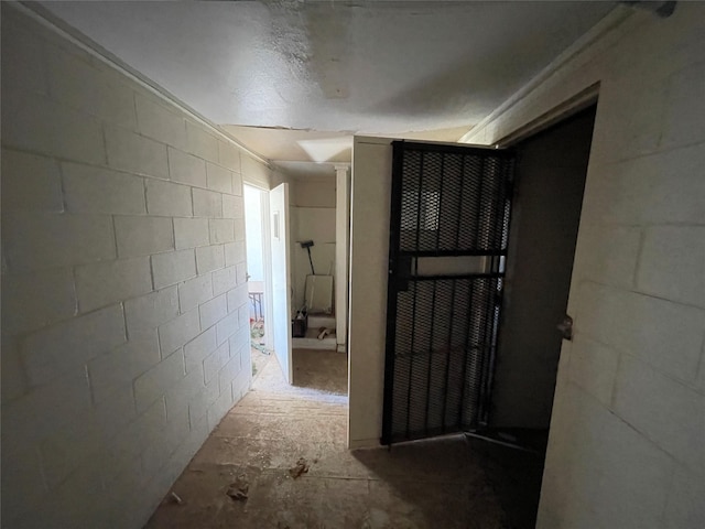 hallway with concrete flooring