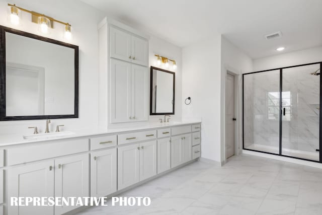 bathroom featuring vanity and a shower with door