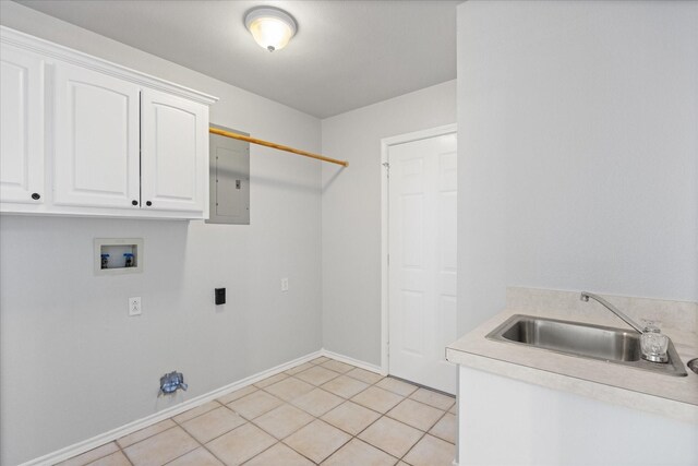 laundry area featuring sink, cabinets, washer hookup, electric panel, and light tile patterned floors