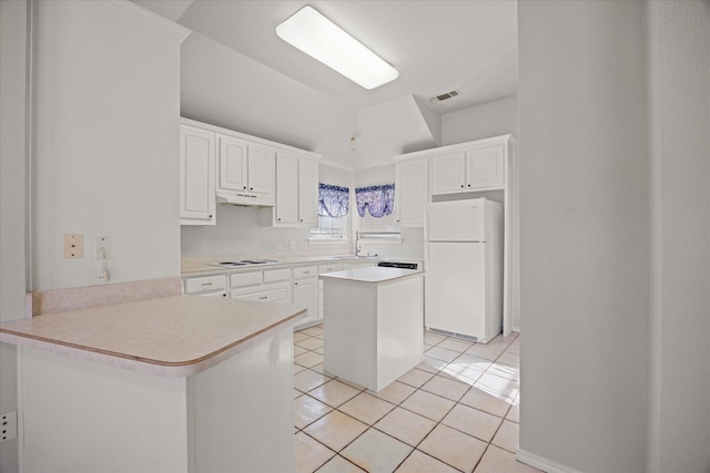 kitchen featuring sink, white cabinets, light tile patterned floors, kitchen peninsula, and white appliances