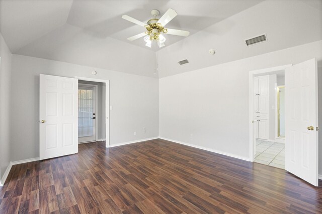 unfurnished room featuring lofted ceiling, dark wood-type flooring, and ceiling fan