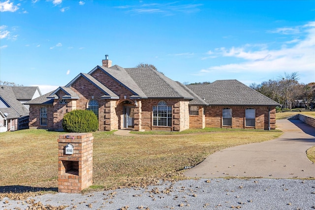 view of front of home with a front yard