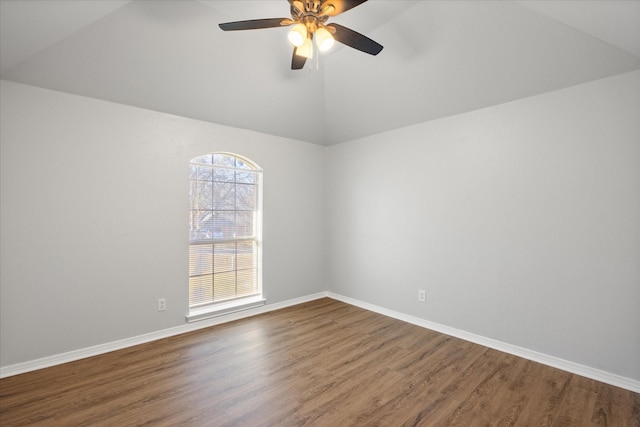 empty room with vaulted ceiling, hardwood / wood-style floors, and ceiling fan