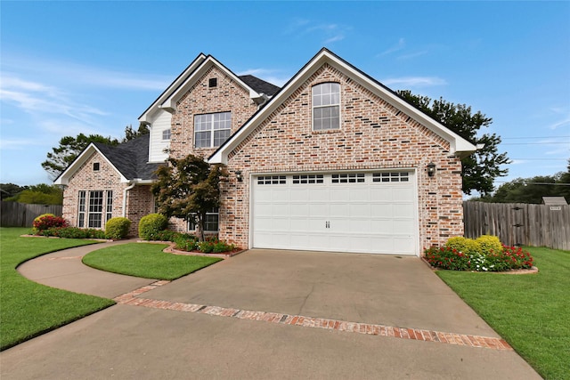 view of front property featuring a front yard and a garage