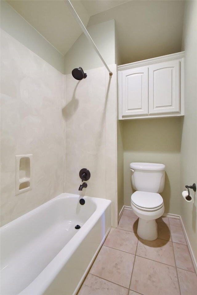 bathroom featuring toilet, tile patterned flooring, and tub / shower combination