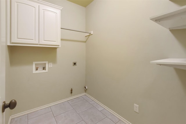 laundry area with washer hookup, electric dryer hookup, cabinets, and light tile patterned floors