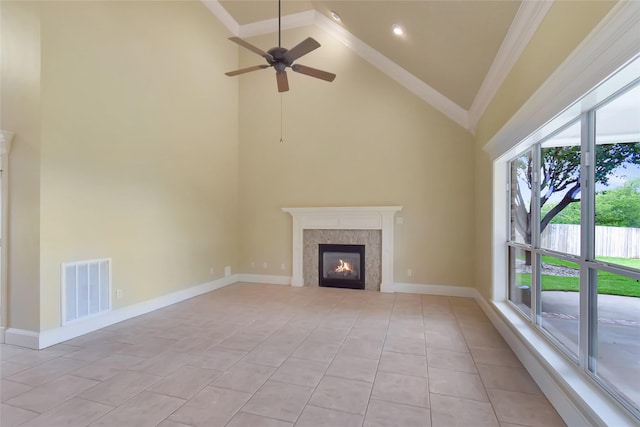 unfurnished living room featuring ceiling fan, high vaulted ceiling, light tile patterned flooring, and ornamental molding