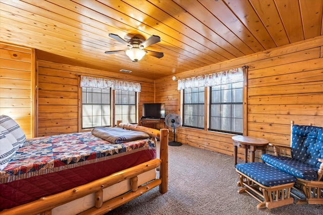 bedroom featuring multiple windows, wooden ceiling, and ceiling fan