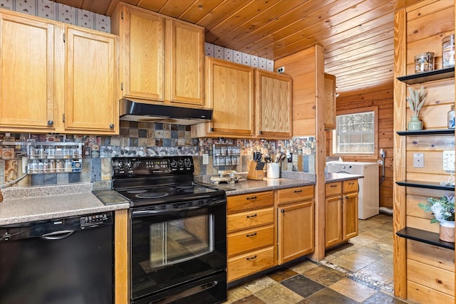 kitchen featuring tasteful backsplash, black appliances, wooden ceiling, washer / clothes dryer, and wood walls