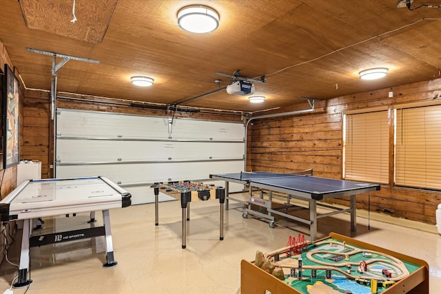 playroom with wooden walls and wood ceiling