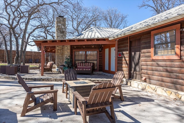 view of patio featuring an outdoor fire pit