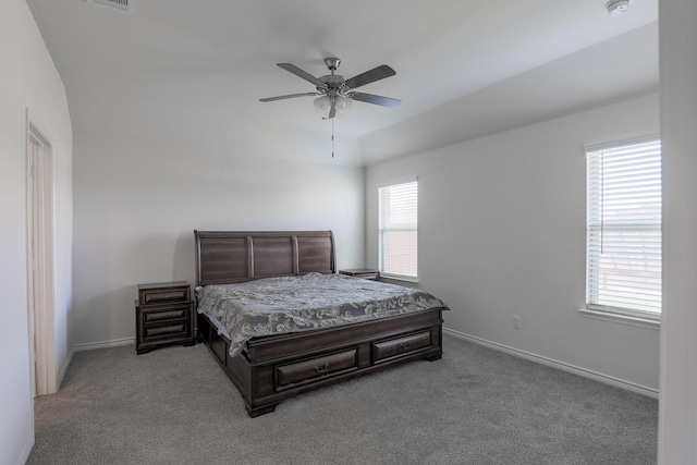 bedroom with carpet, multiple windows, and ceiling fan