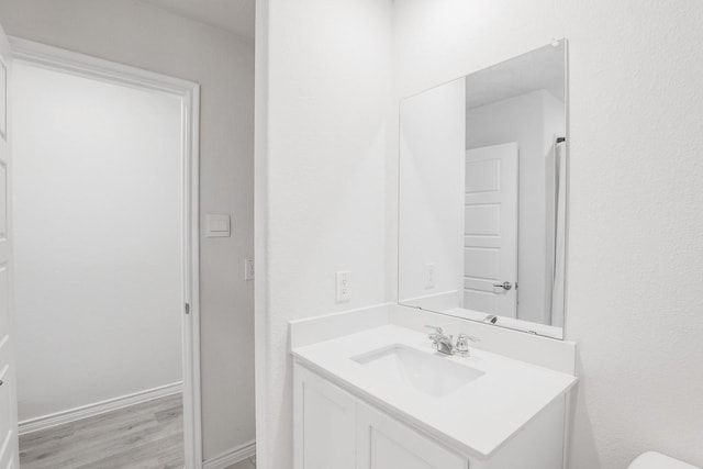 bathroom featuring vanity and wood-type flooring