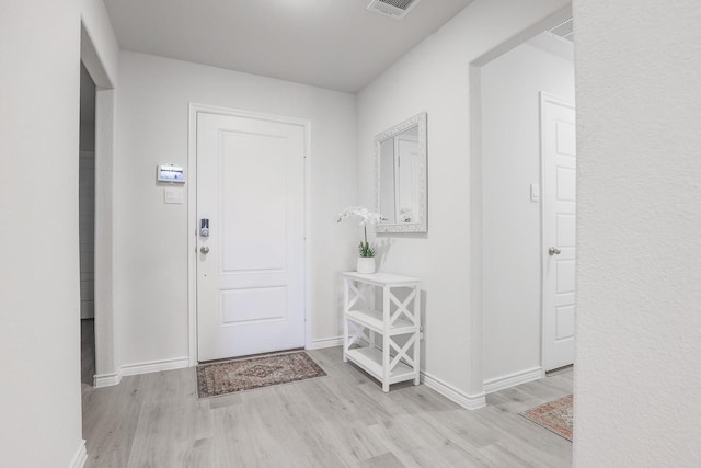 entrance foyer with light hardwood / wood-style floors