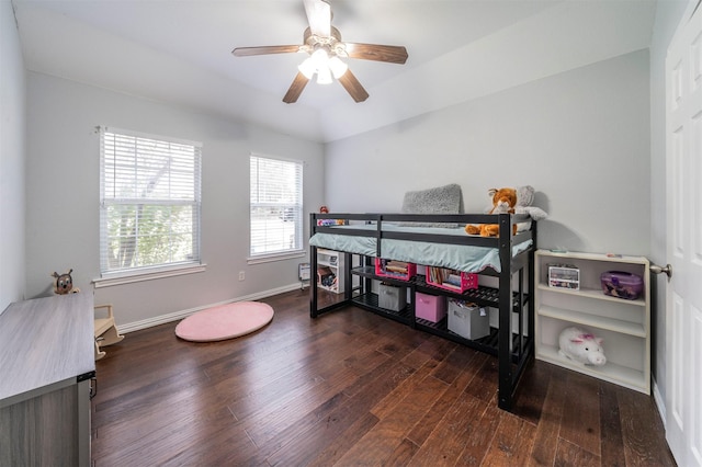 bedroom with ceiling fan and dark wood-type flooring