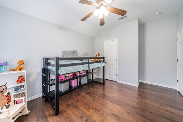 bedroom featuring lofted ceiling, ceiling fan, and dark wood-type flooring