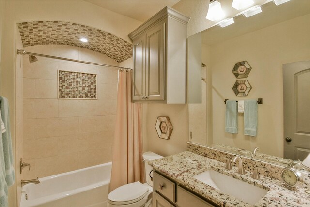 full bathroom featuring vanity, toilet, and shower / bath combo with shower curtain