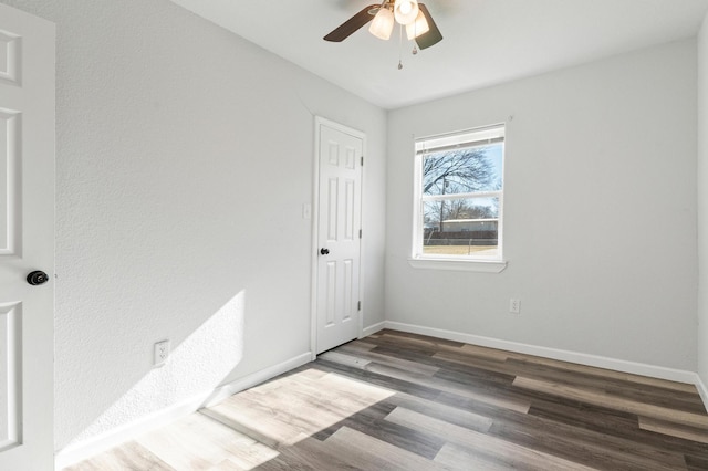 empty room featuring wood-type flooring and ceiling fan