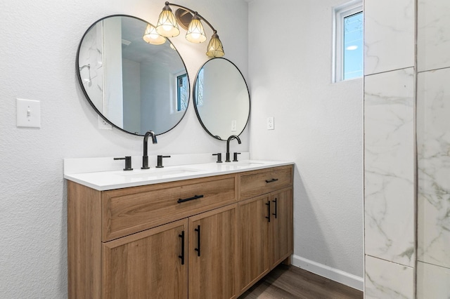 bathroom with vanity and wood-type flooring