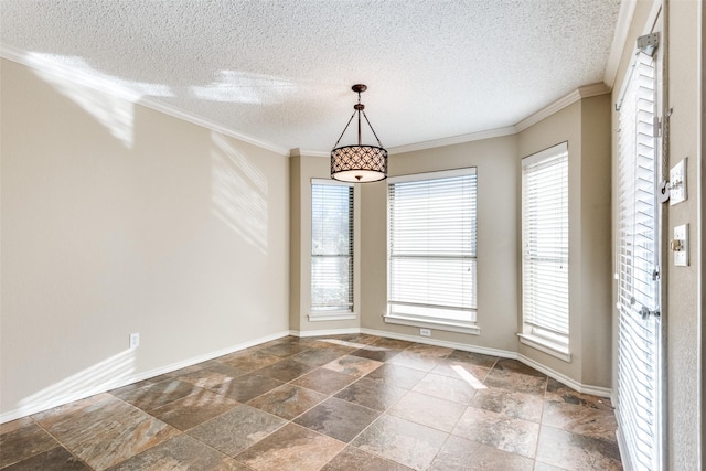 empty room with a textured ceiling and crown molding