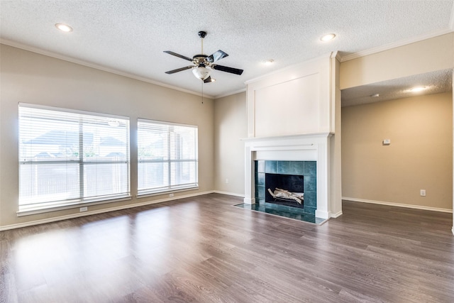 unfurnished living room with dark hardwood / wood-style flooring, a fireplace, and ornamental molding