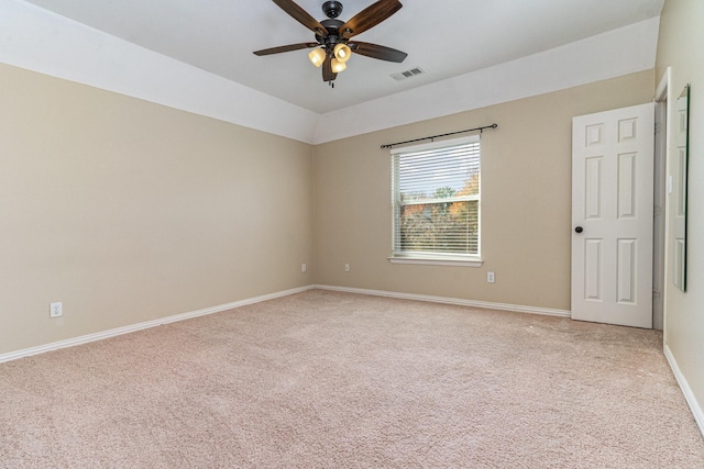 unfurnished room featuring light carpet, lofted ceiling, and ceiling fan