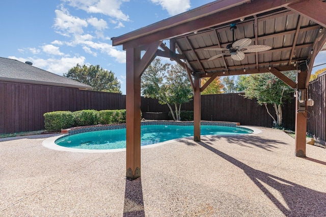 view of swimming pool with ceiling fan and a patio