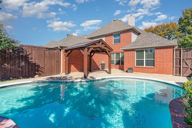 view of swimming pool featuring a gazebo