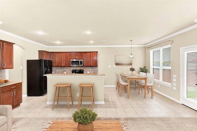 kitchen featuring black refrigerator with ice dispenser, light tile patterned flooring, decorative backsplash, and decorative light fixtures