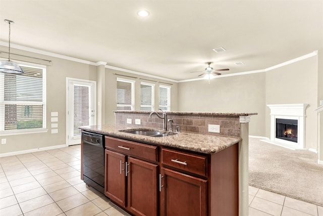 kitchen with dishwasher, sink, backsplash, decorative light fixtures, and light carpet