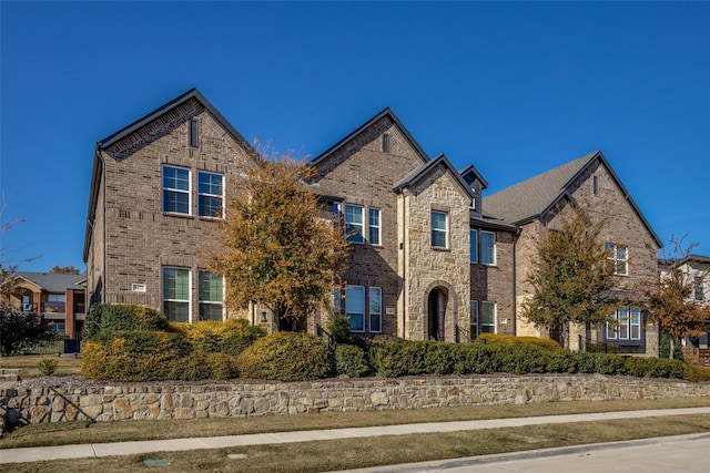 traditional-style home featuring brick siding