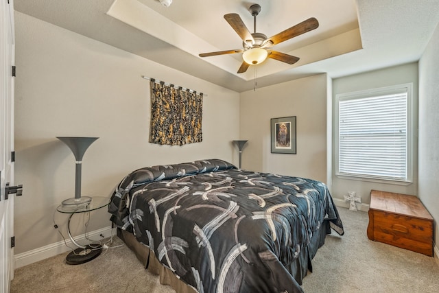 105 Easy St, Glen Rose, TX 76043 - carpeted bedroom featuring a raised ceiling and ceiling fan