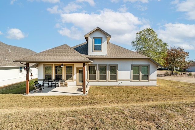 105 Easy St, Glen Rose, TX 76043 - rear view of house featuring stucco siding, ceiling fan, a shingled roof, and a lawn