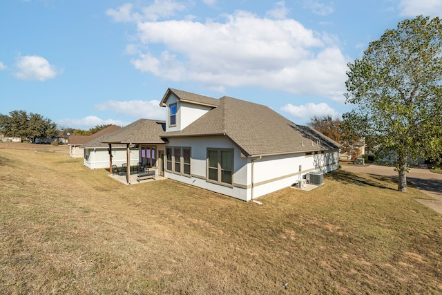 back of property featuring a patio, a yard, and cooling unit