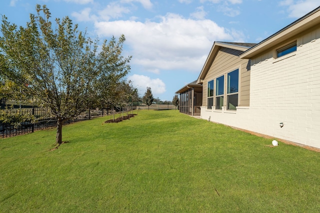 view of yard with a sunroom