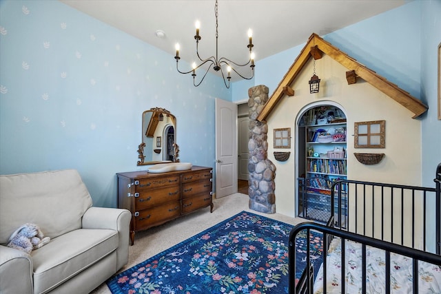 living area with a chandelier, built in shelves, and light colored carpet